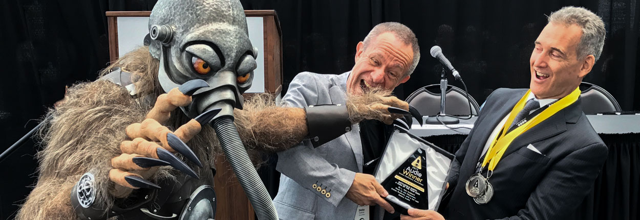 Terl grabbing the Audie Award for Battlefield Earth
